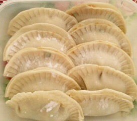 Home cooked Raw, uncooked Japanese Gyoza in plate