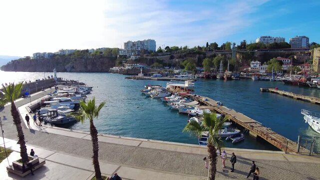 4K Kaleici Marina in Antalya, Turkey. The port in old town Kaleichi. The historic harbour is below the old town&rsquo;s Roman walls and Ottoman-era houses, offers a vibrant view of fishing boats and yachts