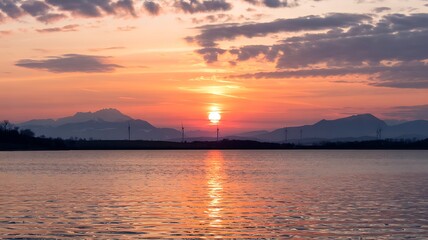 Beautiful Sunset Over Lake Zug Switzerland With Mountains And Wind Turbines Reflecting In The Water Calm Waters And Colorful Sky