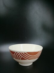 Elegant ceramic bowl with geometric patterns, ideal for home decor or serving food in modern kitchens.