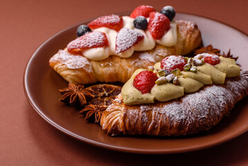 Food for breakfast sweet strawberry croissants with chocolate filling