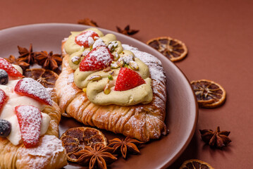 Food for breakfast sweet strawberry croissants with chocolate filling
