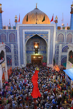 Lal Shahbaz Qalandar shrine.
People entering the shrine on the annual festival with a red shawl as a ritual