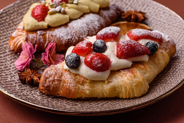 Food for breakfast sweet strawberry croissants with chocolate filling