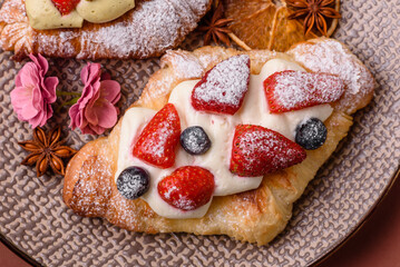 Food for breakfast sweet strawberry croissants with chocolate filling