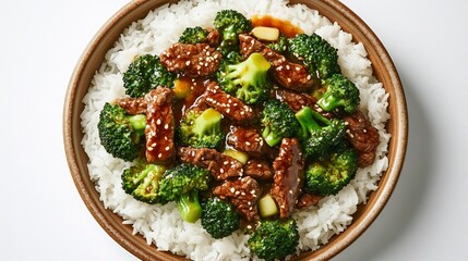 Flat lay of Chinese style beef broccoli stir fried oyster sauce served white rice ceramic dish over clean white background popular American Chinese cuisine rooted Cantonese tradition cut out isolated
