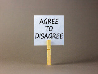 Agree to disagree symbol. Concept words Agree to disagree on beautiful white paper on wooden...
