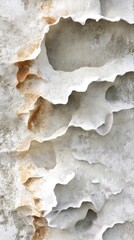 Close-up view of weathered, textured coastal rock formations.