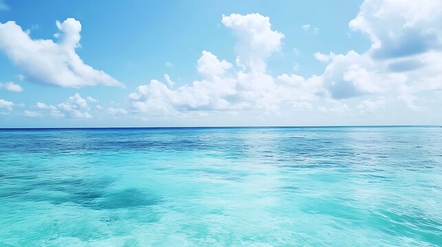 Faded turquoise ocean horizon under a pale blue sky, creating a dreamy summer vibe