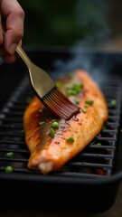 A person brushes marinade onto salmon fillet with chopped green onions on a sizzling grill, emphasizing fresh culinary preparation