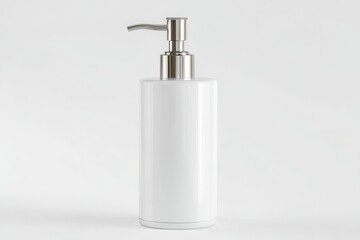 Obraz premium Sleek white soap dispenser with a modern silver pump. Perfect for minimalist bathrooms.