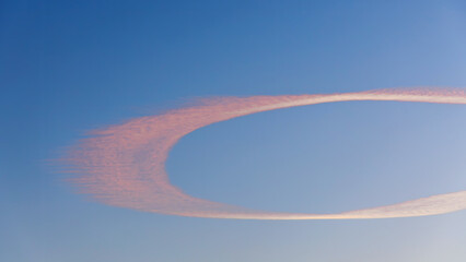 Beautiful patterns in the sky left by a passing airplane