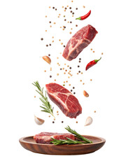 Juicy steaks falling onto a plate rosemary garlic pepper chili delicious food photography