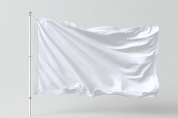 Blank white flag waving gently on a pole against a neutral background.