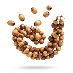 Wooden beads broke apart and are falling, isolated on a white