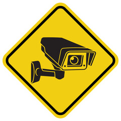 security camera surveillance signage yellow and black