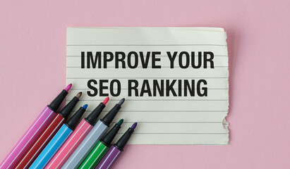 A piece of paper with a black marker that says Improve Your SEO Ranking