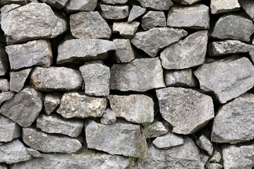 Obraz premium Natural stone wall made of large stones