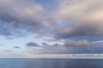 Serene Ocean Horizon Under Cloudy Sky at Sunset in Kailua-Kona, Hawaii