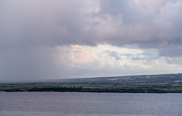 Stormy Clouds Over Kailua-KonaShoreline with Ocean in Foreground