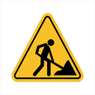 under construction warning sign with worker digging symbol inside yellow triangle indicating roadwork alert