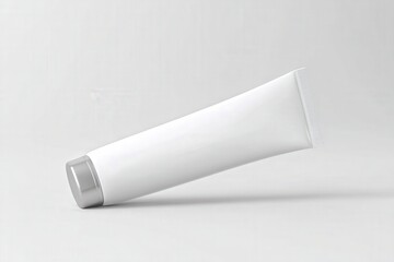 Sleek white tube with silver cap, minimalist design.