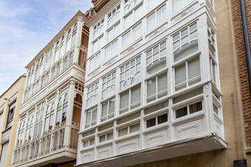 Historic White Wooden Balconies on Colorful Buildings in La Rioja, Spain, Showcasing Traditional...