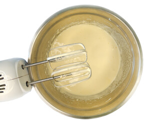 Top view of whipped eggs and sugar in a stainless steel mixing bowl, blended with a hand mixer, ready for baking or cooking.