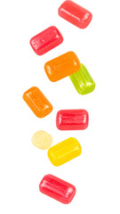 Colorful fruit flavored taffy candies falling down on transparent background
