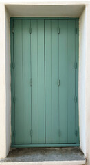 Window with wooden shutters on a house