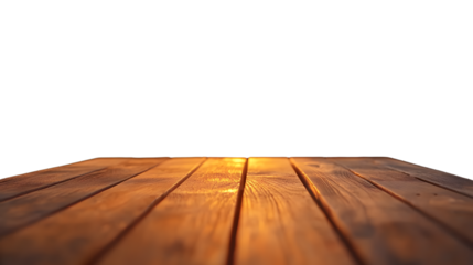 A wooden table is set against a blurred backyard with a sunset and grill. Concept of outdoor grilling.