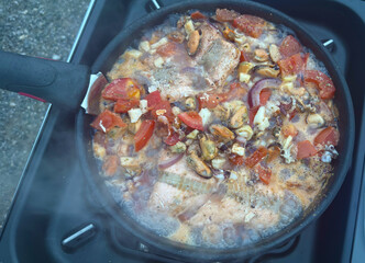 Grilled mussels vegetable pan preparation on the grill