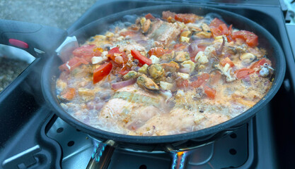 Grilled mussels vegetable pan preparation on the grill