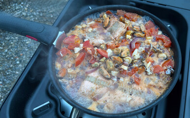 Grilled mussels vegetable pan preparation on the grill