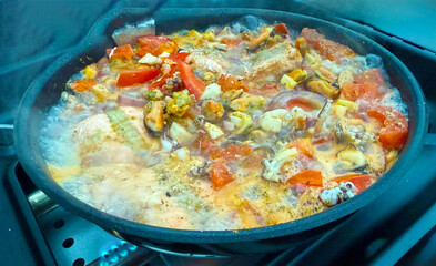 Grilled mussels vegetable pan preparation on the grill