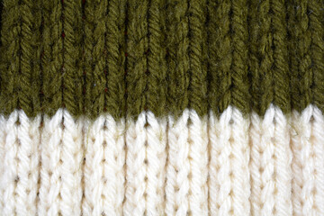 Detailed white and army green wool texture background. Rib stitch knitting pattern. 