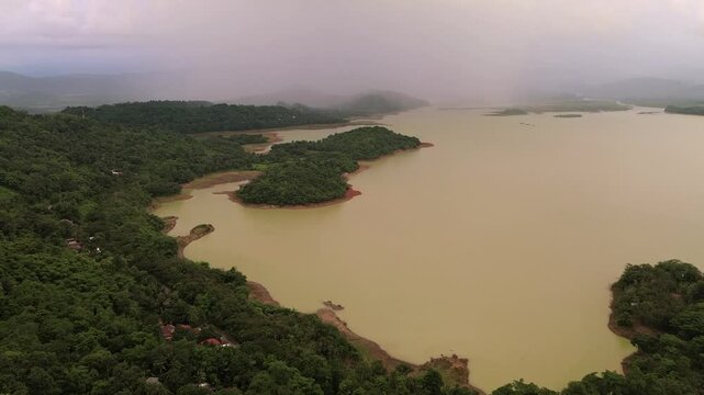 Storm Clouds Loom Over a bili bili Reservoir Lake in the Late Afternoon in sulawesi