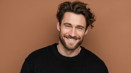 Fototapeta premium A portrait of a handsome young man smiling, isolated on a background