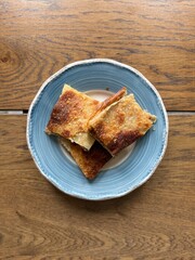 Homemade Alt ust boregi or Rumeli Borek on wooden table