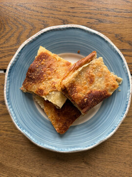 Homemade Alt ust boregi or Rumeli Borek on wooden table