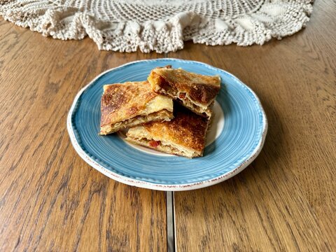 Homemade Alt ust boregi or Rumeli Borek on wooden table