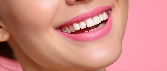 Obraz premium Close-Up of Smiling Woman with Pink Lipstick and Healthy Teeth