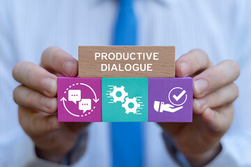 Doctor holding colored blocks with icons sees inscription: PRODUCTIVE DIALOGUE. Productive dialogue...