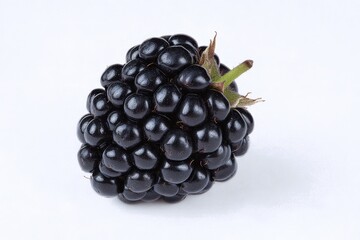 Fototapeta premium Close-up of a single, ripe blackberry against a white background.