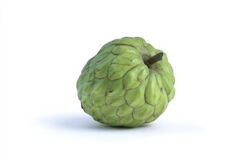 Obraz premium A single cherimoya fruit, vibrant green, sits on a white background.
