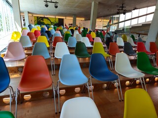 A lot of colorful chairs. Seats Color, Mixed color seats.