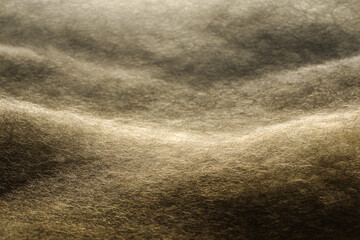 Fototapeta premium Textured Sand Dune: Abstract image of sand dune texture, featuring subtle light and shadow play across undulating surface, creating a sense of depth and movement.