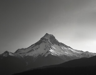 Majestic Mount Hood in winter. Snowy mountain peak landscape under gray sky. Iconic volcano in Oregon. Black and white photo of natural scenic area, showcasing beauty of nature, perfect for travel.