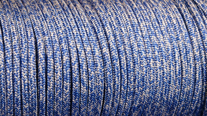 A blue and white rope is shown in the image. rope is long and has a striped pattern. blue and white...