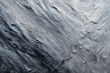 Textured Terrain: An abstract view reveals the intricate details of textured rock formations with rugged layers and natural erosion patterns.